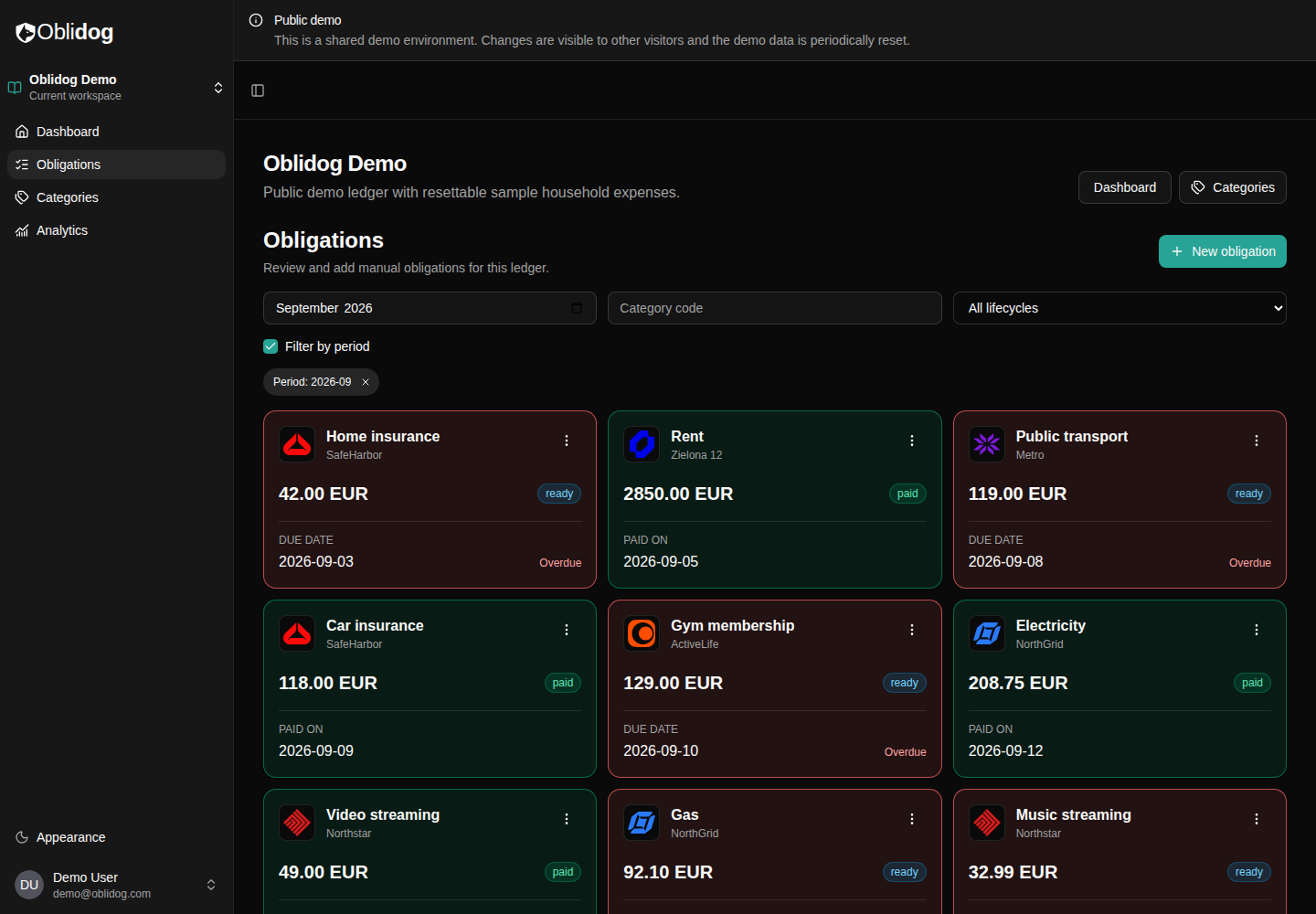 Oblidog obligations view in dark mode, showing monthly bills and their payment status